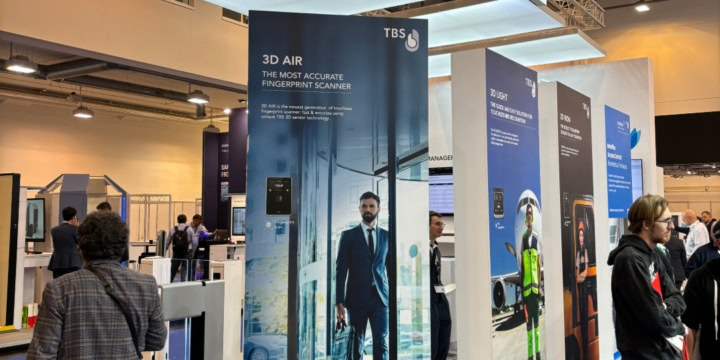 Messestand von Interflex und TBS auf der Security Essen 2024 mit TBS-Aufsteller im Vordergrund